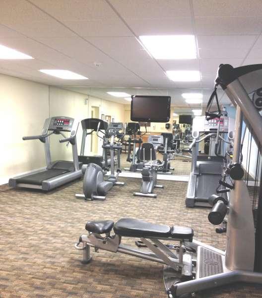 A fully equipped gym at Crossings at Stanbridge apartments for rent