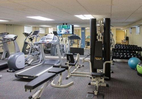 Fitness center with exercise equipment at Sedgwick Gardens apartments for rent in Philadelphia, PA